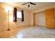 Bright bedroom featuring large windows, tile flooring, and ample closet space at 11332 8Th Ave, Punta Gorda, FL 33955