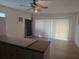 The living room features wood floors, ceiling fan, and sliding glass doors at 11332 8Th Ave, Punta Gorda, FL 33955