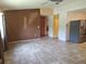 Spacious living room featuring tile flooring, a ceiling fan, and neutral paint palette at 11332 8Th Ave, Punta Gorda, FL 33955