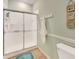 Clean bathroom with a shower/tub combo, and a teal bathmat at 1152 Green Oak Trl, Port Charlotte, FL 33948