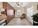 Home office with built-in shelving and a comfortable chair at 1152 Green Oak Trl, Port Charlotte, FL 33948