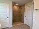 Modern bathroom featuring a tiled walk-in shower with a glass door and neutral colors at 13480 Allentown Ave, Port Charlotte, FL 33981