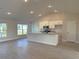 Open concept kitchen with granite countertops, stainless steel appliances, and a breakfast bar at 13480 Allentown Ave, Port Charlotte, FL 33981