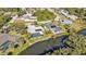 Aerial view of canal-front home with pool and private dock at 1542 Yorkshire St, Port Charlotte, FL 33952