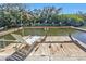 Relax on this waterfront dock with canal views and lush greenery at 1542 Yorkshire St, Port Charlotte, FL 33952