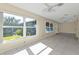 Sunroom with pool view and access to patio at 1542 Yorkshire St, Port Charlotte, FL 33952