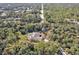 Bird's-eye view of home, driveway, and surroundings at 1811 Music Ln, North Port, FL 34286