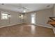 Primary bedroom with wood-look floors and access to patio at 1811 Music Ln, North Port, FL 34286