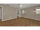 Primary bedroom with wood-look floors and en-suite bathroom at 1811 Music Ln, North Port, FL 34286
