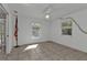 Bedroom with tile flooring, ceiling fan, and large window at 1811 Music Ln, North Port, FL 34286