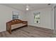 Bedroom with wood-look flooring and a built-in daybed at 1811 Music Ln, North Port, FL 34286