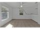 Bright bedroom with tile flooring and ceiling fan at 1811 Music Ln, North Port, FL 34286