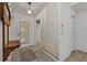Bright entryway with painted wall and a wooden bench at 1811 Music Ln, North Port, FL 34286