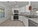 Modern kitchen featuring stainless steel appliances and ample counter space at 1811 Music Ln, North Port, FL 34286