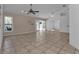Spacious living room with tile flooring and access to the backyard at 1811 Music Ln, North Port, FL 34286