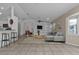 Bright living room featuring tile floors, built-in shelving, comfortable seating and lots of natural light at 1811 Music Ln, North Port, FL 34286