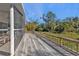 Wooden deck overlooking lush natural landscape at 1811 Music Ln, North Port, FL 34286