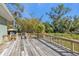 Spacious wooden deck offering tranquil backyard views at 1811 Music Ln, North Port, FL 34286