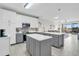 Modern kitchen with gray and white cabinets, quartz countertops, and stainless steel appliances at 2002 Bal Harbor Blvd # 1312, Punta Gorda, FL 33950