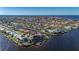 Stunning aerial view of a waterfront property nestled in a canal-front community at 2102 Palm Tree Dr, Punta Gorda, FL 33950
