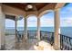 Balcony with expansive water views and a private boat dock at 2102 Palm Tree Dr, Punta Gorda, FL 33950