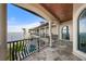 Balcony with tile floor, arched openings, columns, and water views at 2102 Palm Tree Dr, Punta Gorda, FL 33950