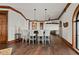 Bar area with counter seating, wood floor, and white walls at 2102 Palm Tree Dr, Punta Gorda, FL 33950