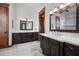 Elegant bathroom with dark wood cabinets and white countertops at 2102 Palm Tree Dr, Punta Gorda, FL 33950