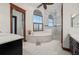 Luxurious Primary bath with soaking tub, large shower, and dual vanities at 2102 Palm Tree Dr, Punta Gorda, FL 33950