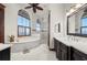 Spacious bathroom featuring a soaking tub, walk-in shower, and double vanity at 2102 Palm Tree Dr, Punta Gorda, FL 33950