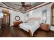 Primary bedroom with wood floors, ceiling fan, and access to a balcony at 2102 Palm Tree Dr, Punta Gorda, FL 33950
