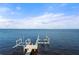 Private boat dock with lifts, extending into calm waters at 2102 Palm Tree Dr, Punta Gorda, FL 33950