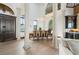 Dining room with wood table, modern chandelier, and view of entryway at 2102 Palm Tree Dr, Punta Gorda, FL 33950
