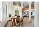Dining room with wooden table, chandelier, and open view to kitchen at 2102 Palm Tree Dr, Punta Gorda, FL 33950