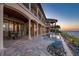 Luxury home exterior with pool, fire pit, and waterfront views at sunset at 2102 Palm Tree Dr, Punta Gorda, FL 33950