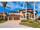 Beautiful home with a tile roof, arched entry, and a three-car garage at 2102 Palm Tree Dr, Punta Gorda, FL 33950