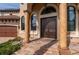Grand double-door entry with decorative columns and a brick walkway at 2102 Palm Tree Dr, Punta Gorda, FL 33950