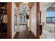 Hallway with wood floors, columns, and arched doorways at 2102 Palm Tree Dr, Punta Gorda, FL 33950