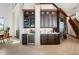 Kitchen with dark wood cabinetry, wine fridge, and built-in appliances at 2102 Palm Tree Dr, Punta Gorda, FL 33950