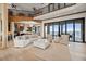 Open-concept living room with high ceilings, water views, and a modern kitchen at 2102 Palm Tree Dr, Punta Gorda, FL 33950