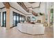 Spacious living area with fireplace, soaring ceilings, and waterfront views at 2102 Palm Tree Dr, Punta Gorda, FL 33950