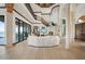 Spacious living room with high ceilings, white furniture, and fireplace at 2102 Palm Tree Dr, Punta Gorda, FL 33950