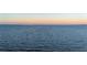 Tranquil open water with channel markers and distant shoreline at sunset at 2102 Palm Tree Dr, Punta Gorda, FL 33950