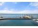Inviting pool overlooking a serene waterfront with a private dock at 2102 Palm Tree Dr, Punta Gorda, FL 33950