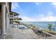 Pool, fire pit, and dock with waterfront views at 2102 Palm Tree Dr, Punta Gorda, FL 33950