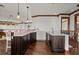 Home bar with dark wood cabinetry, quartz countertops, and amethyst accents at 2102 Palm Tree Dr, Punta Gorda, FL 33950