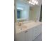 Bathroom with double vanity and large mirror at 2630 Tarpon Cove Dr # 211, Punta Gorda, FL 33950