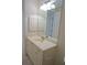 Bathroom vanity with a large mirror and ample storage at 2630 Tarpon Cove Dr # 211, Punta Gorda, FL 33950