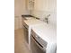 Laundry room featuring a washer, dryer, and cabinets at 2630 Tarpon Cove Dr # 211, Punta Gorda, FL 33950