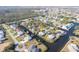 Aerial view of canal-front home with private dock and lush landscaping at 3004 Banyan Way, Punta Gorda, FL 33950